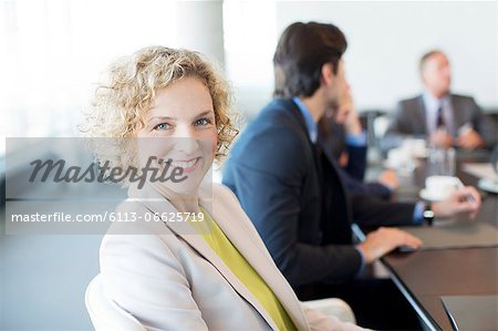 Businesswoman smiling in meeting