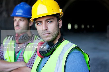 Workers looking out from tunnel