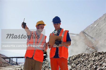 Workers talking in quarry