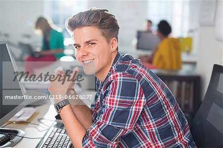 Businessman smiling at desk