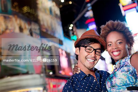 Couple smiling together on city street