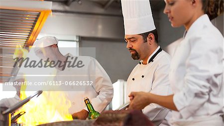 Chefs cooking in restaurant kitchen