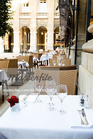 Street view of a coffee terrace with tables and chairs,paris France