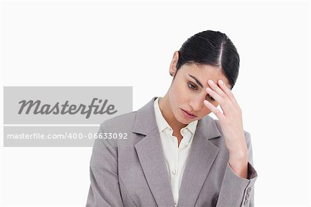 Young businesswoman looking sad against a white background