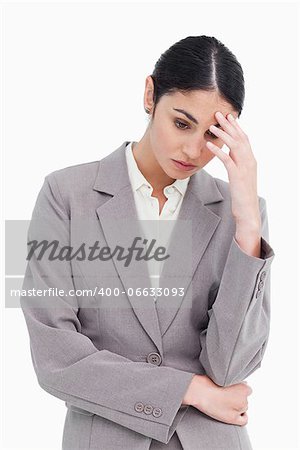 Young saleswoman looking sad against a white background