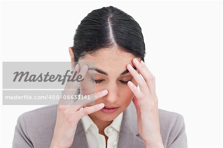 Close up of tired businesswoman against a white background