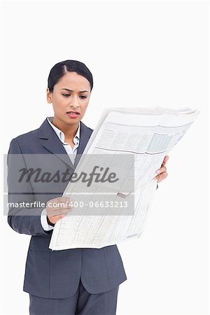 Close up of saleswoman reading the news against a white background