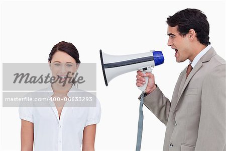 Salesman yelling at colleague with megaphone against a white background