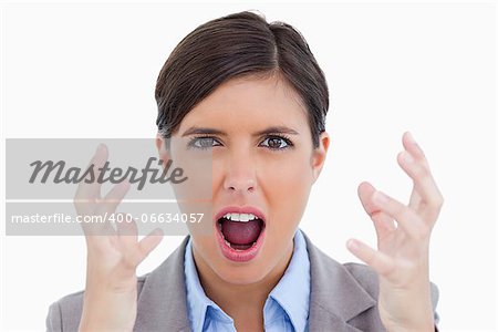 Close up of angry shouting entrepreneur against a white background