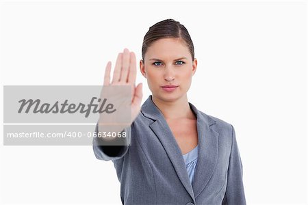 Tradeswoman showing her palm against a white background