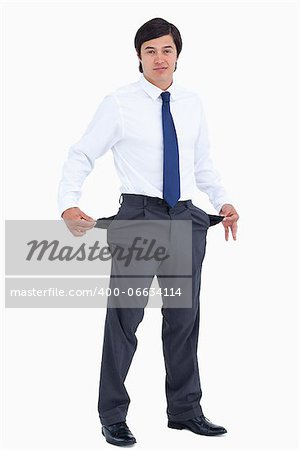 Tradesman showing his empty pockets against a white background
