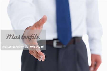 Hand of tradesman ready to be shaken against a white background