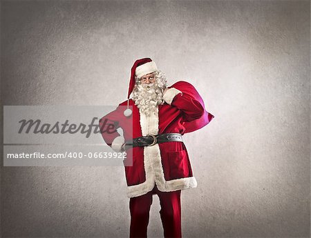 Santa Claus with his sack on a dark white background