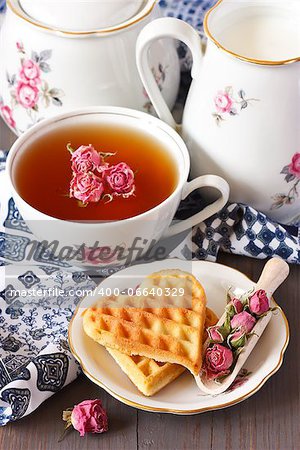 Cup of tea, fresh milk and Belgian waffles for breakfast.