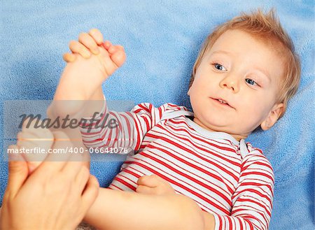 Studio portrait of a happy one year old baby boy.