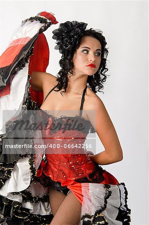 Young sexy brunette dancing in studio a french cancan