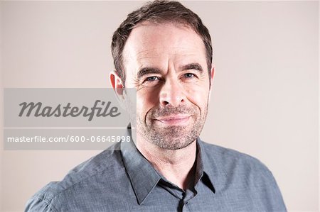 Head and Shoulders Portrait of Mature Man in Studio