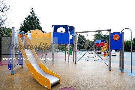 Slide and climbing web in children's playground