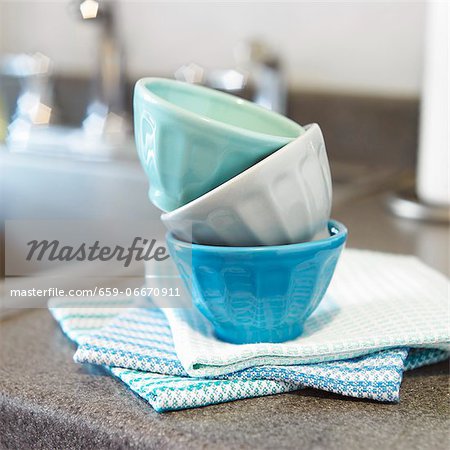Small Prep Bowls Stacked on Kitchen Towels on a Kitchen Counter