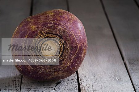 A turnip on a wooden surface