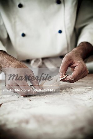 A chef making a tortellino A chef making a tortellino