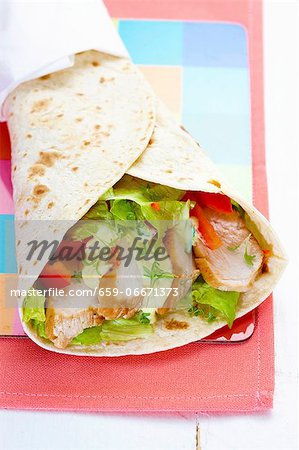 Chicken, salad and tomato wrap