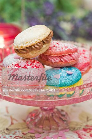 Macaroons filled with buttercream on a cake stand