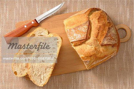 Overhead View of Bread on Cutting Board with Knife