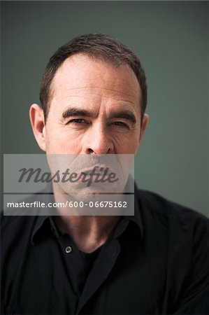 Head and Shoulders Portrait of Upset Mature Man