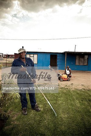 Male black adult tending a garden