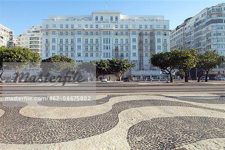 Copacabana Palace Hotel, Avenida Atlantica, Copacabana Beach, the Copacabana Palace hotel and Avenida Atlantica with the black and white Portuguese paving on the sidewalk in the foreground