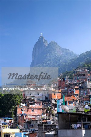 South America, Rio de Janeiro, Rio de Janeiro city, view of breeze block houses in the Dona Marta favela, Santa Marta community, with Corcovado and the Christ statue behind