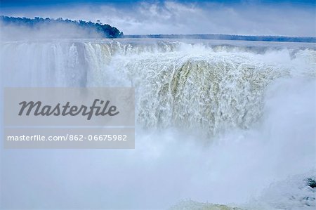 South America, Brazil, Parana, view of the Devils Throat at the Iguazu falls when in full flood during a rain storm.