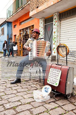 South America, Brazil, Sao Paulo, Embu das Artes, an accordion player performing during the arts and crafts weekend market
