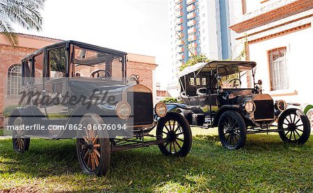 South America, Brazil, Sao Paulo, vintage Ford police cars outside the Memorial do Imigrante immigration museum in Mooca neighbourhood in Central Sao Paulo