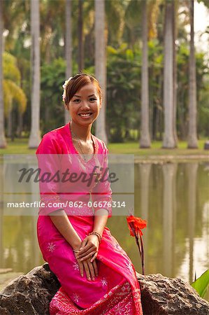 China, Yunnan, Mengla. Beautiful guide from the Dai ethnic minority group in the Xishuangbanna Tropical Botanical Gardens.