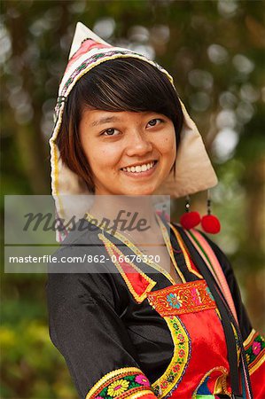 China, Yunnan, Xishuangbanna. A pretty girl of the Jinuo ethnic minority near Jinghong.