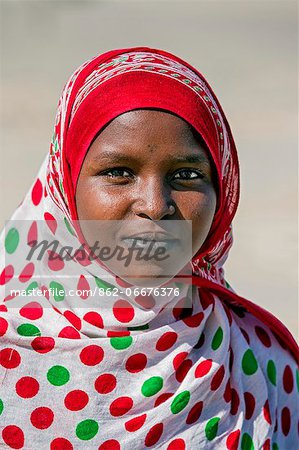 Chad, Kanem, Bahr el Ghazal, Sahel. A pretty Kreda girl with a small tribal mark on her forehead and stained lower lip.