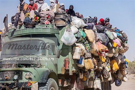 Chad, Kanem, Bahr el Ghazal, Sahel. A grossly over-loaded lorry travelling on the rough Bahr el Ghazal route from Faya.