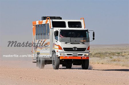 Africa, Namibia, Namib Naukluft Park, Truck on a dusty road