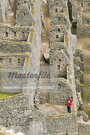 South America, Peru, Cusco, Machu Picchu. A general view of wasi houses at the World Heritage listed Inka Historic Sanctuary of Machu Picchu, situated in the Andes above the Urubamba valley South America, Peru, Cusco, Machu Picchu. A general view of wasi houses at the World Heritage listed Inka Historic Sanctuary of Machu Picchu, situated in the Andes above the Urubamba valley
