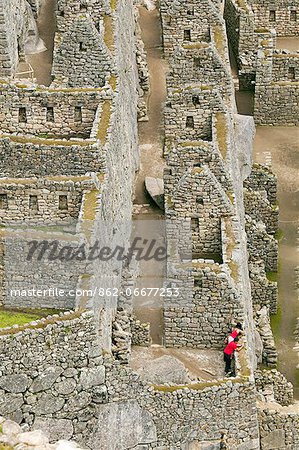 South America, Peru, Cusco, Machu Picchu. A general view of wasi houses at the World Heritage listed Inka Historic Sanctuary of Machu Picchu, situated in the Andes above the Urubamba valley