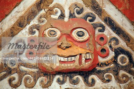 South America, Peru, La Libertad, Trujillo, detail of a mural on the Moche Temple of the Moon showing the decapitator god Ai Apaec