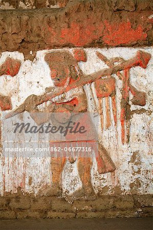 South America, Peru, La Libertad, Trujillo, detail of a mural on the Moche Temple of the Moon showing a moche priest or warrior with a mace or spear