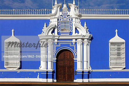 South America, Peru, La Libertad, Trujillo, traditional iron lattice colonial windows and a baroque doorway, on the main square with the municipal cathedral in the background