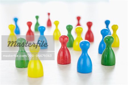 close-up of multi-colored playing pieces on white background