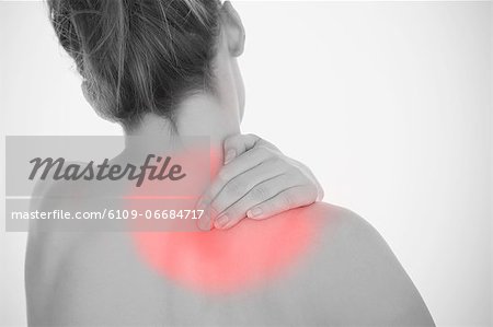 Woman rubbing shoulder pain