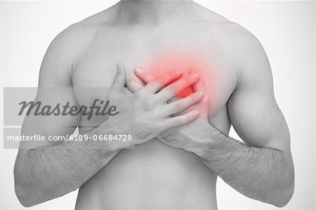 Man touching chest pain