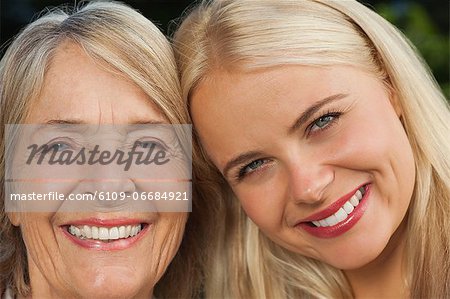Mother and adult daughter close up portrait