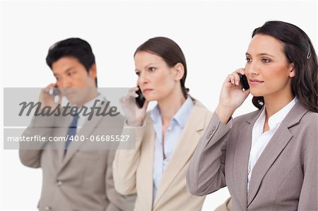 Businesspeople on the phone against a white background